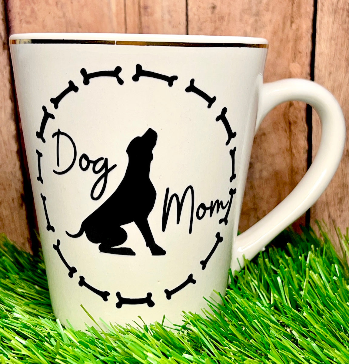 dog mom coffee cup in a grass